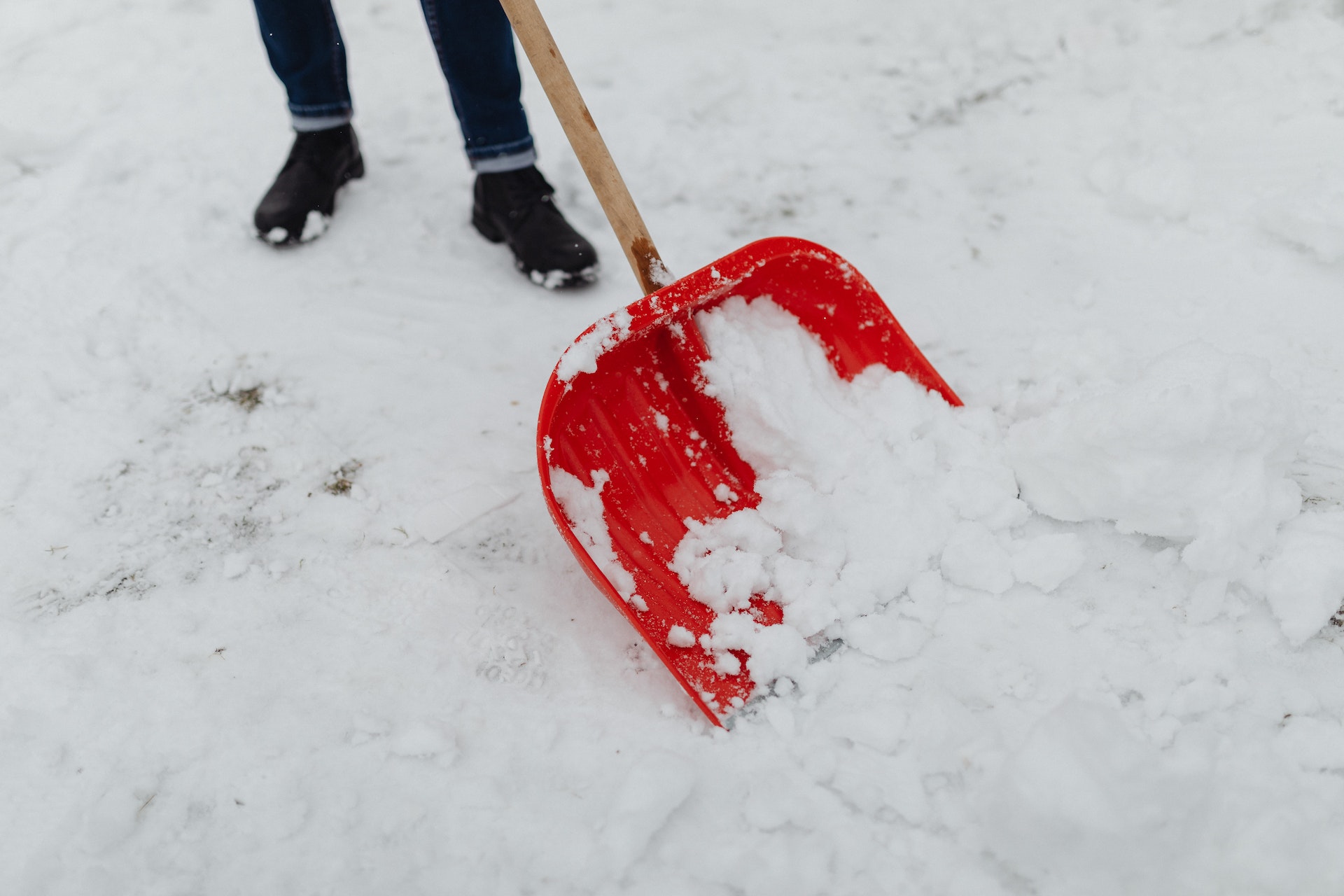 Close-up of Person Shoveling Snow Outdoors